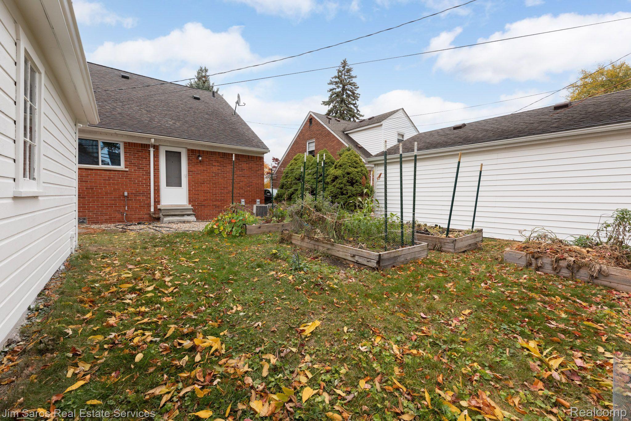 2053 Vernier Road Grosse Pointe, MI 48236 - Photo 14 of 14 Rear with Entry/Exit Door to 1st Floor Bedroom