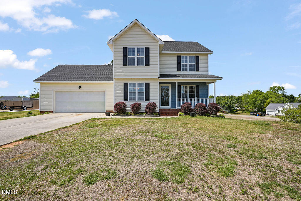 1560 Cane Mill Road Coats, NC 27521 - Photo 2 of 32 a front view of a house with garden