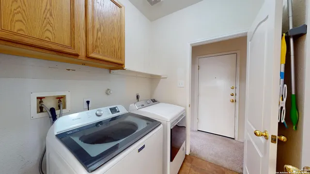 a utility room with dryer and washer