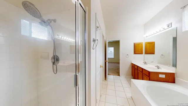 a bathroom with a double vanity sink double vanity and a mirror
