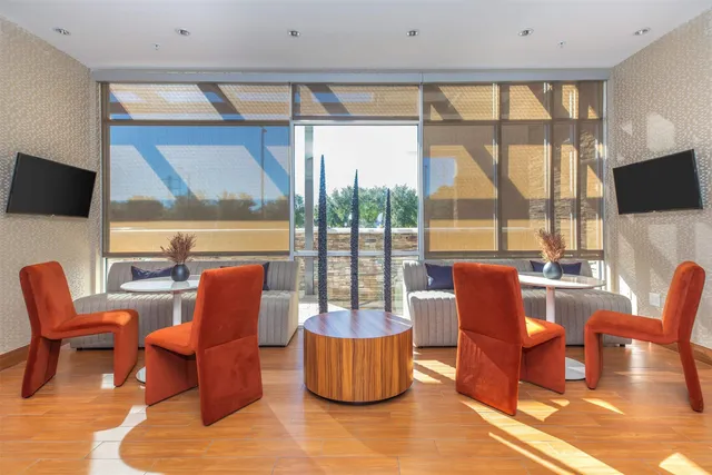 a room with gym equipment and a flat screen tv