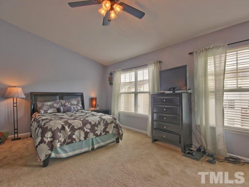 5116 Sandy Banks Road Raleigh, NC 27616 - Photo 12 of 21 a bedroom with a bed and a television