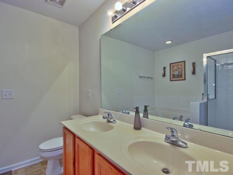 5116 Sandy Banks Road Raleigh, NC 27616 - Photo 14 of 21 a bathroom with a sink and a toilet