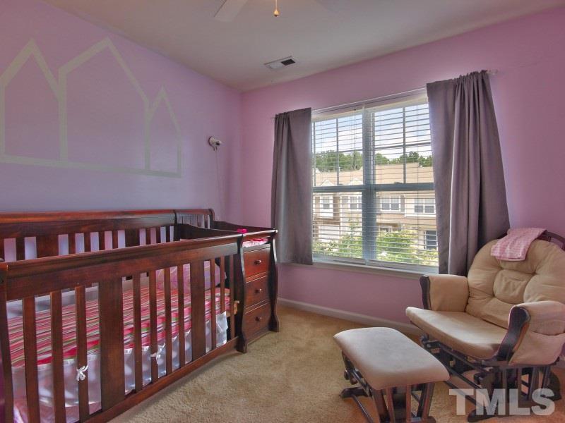 5116 Sandy Banks Road Raleigh, NC 27616 - Photo 17 of 21 a bedroom with furniture and a window