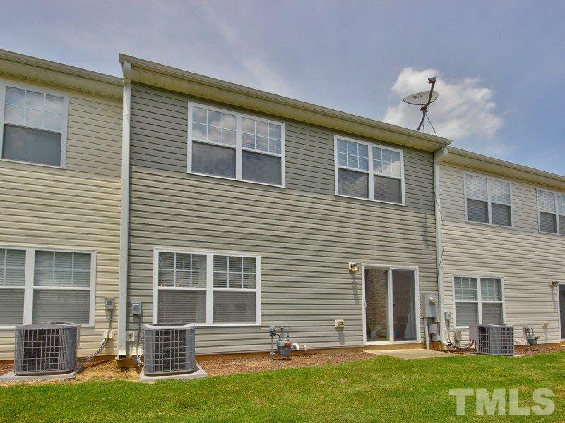5116 Sandy Banks Road Raleigh, NC 27616 - Photo 19 of 21 a front view of a house with a yard