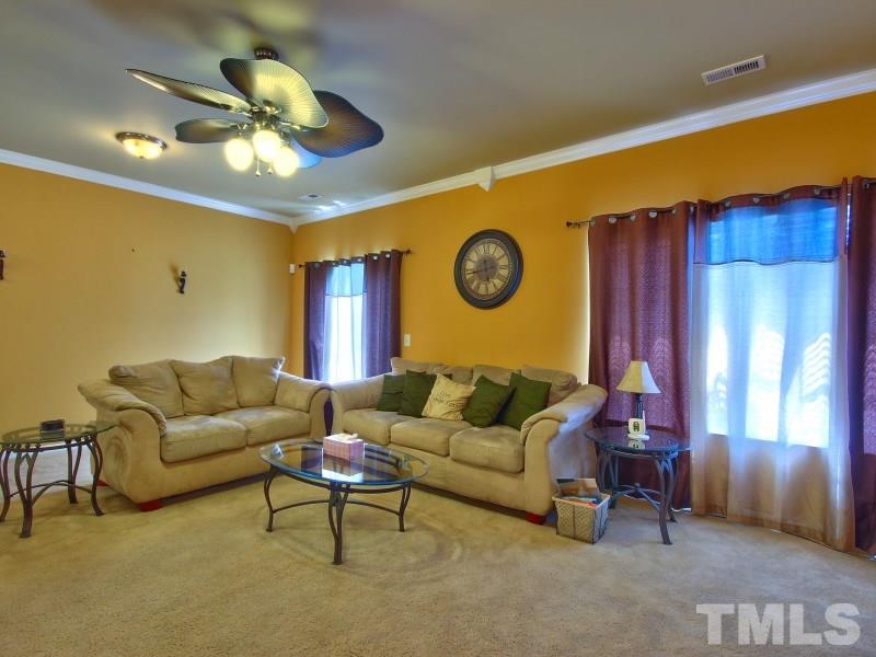 5116 Sandy Banks Road Raleigh, NC 27616 - Photo 7 of 21 a living room with furniture and a large window
