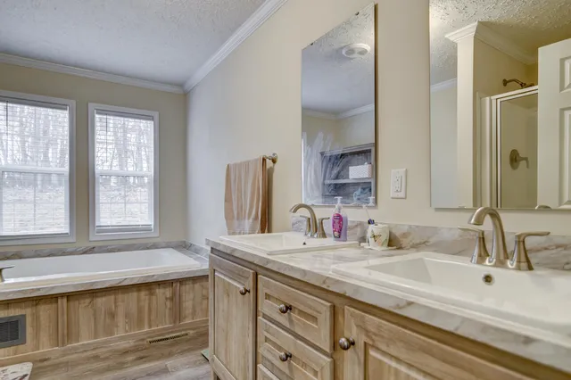 a white toilet sitting next to a bathroom sink