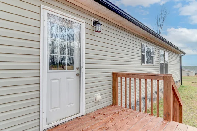 a view of wooden fence and trees