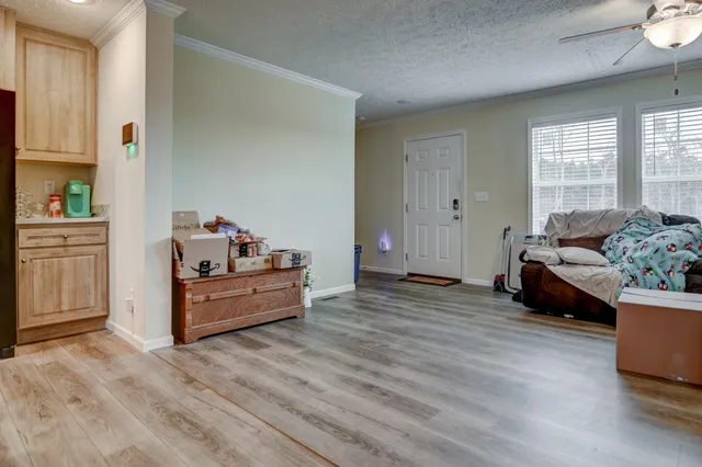 a living room with furniture and windows
