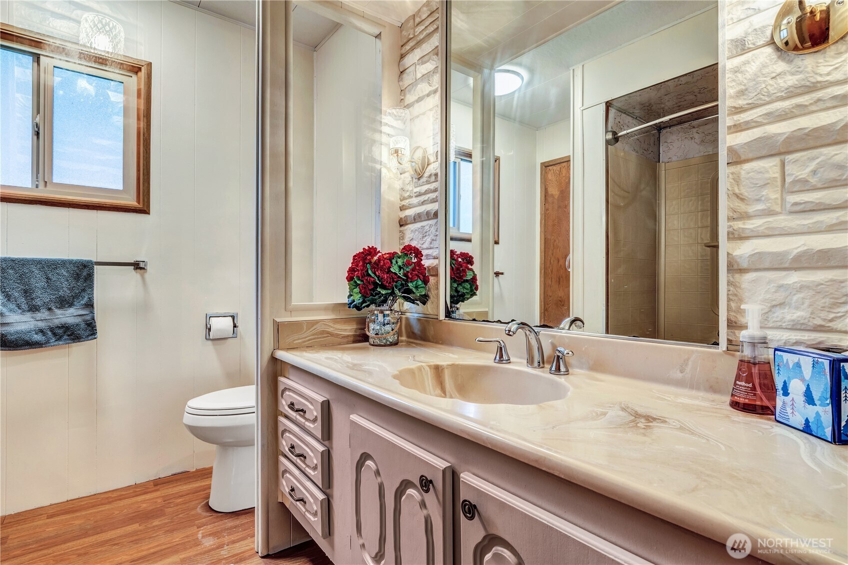 18425 Northeast 95th Street, Unit 110 Redmond, WA 98052 - Photo 14 of 25 a bathroom with a sink and a mirror