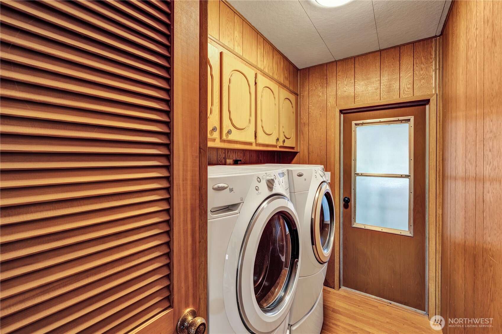 18425 Northeast 95th Street, Unit 110 Redmond, WA 98052 - Photo 15 of 25 a view of a hallway with washer and dryer