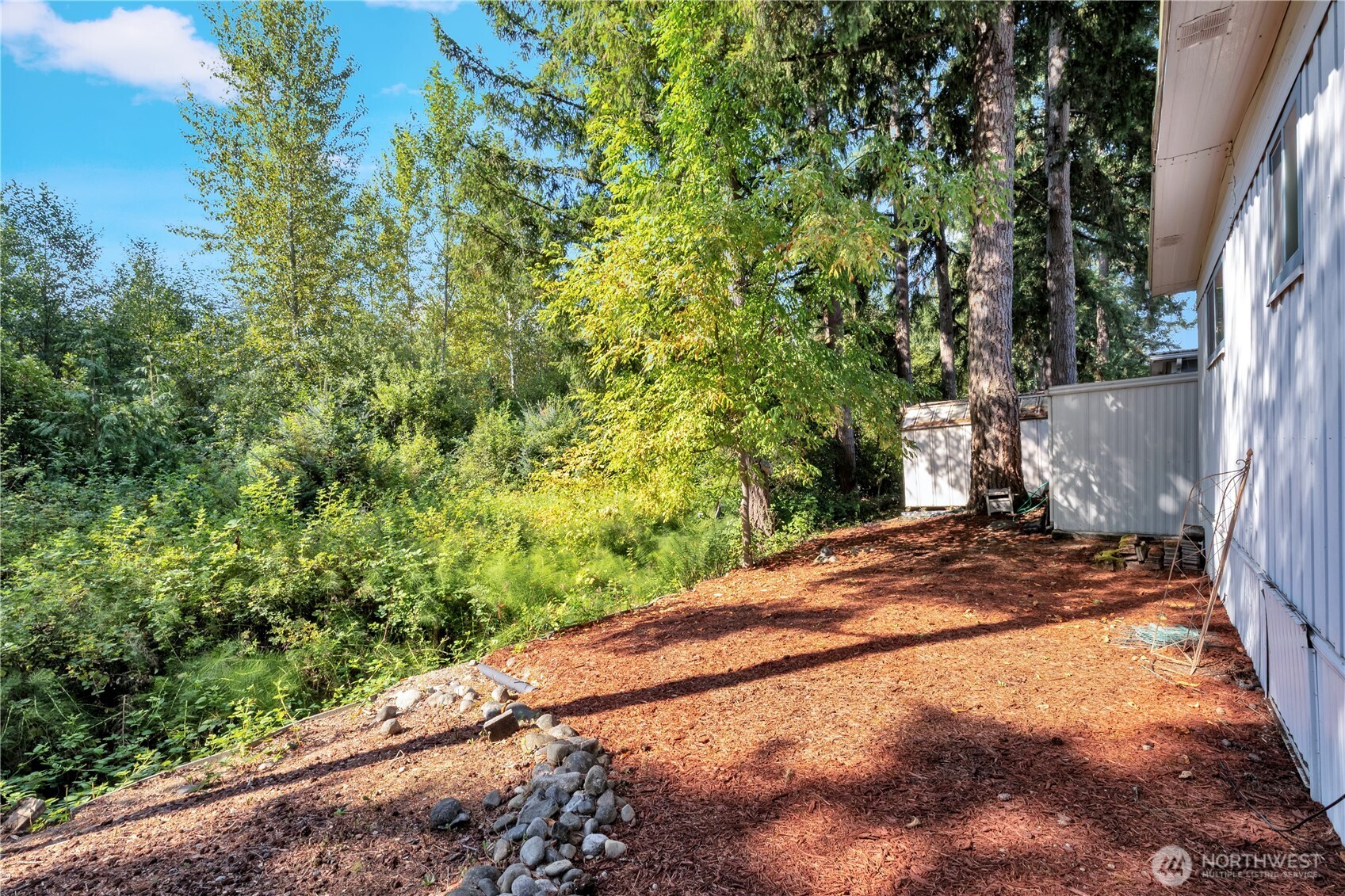 18425 Northeast 95th Street, Unit 110 Redmond, WA 98052 - Photo 16 of 25 a view of a yard with plants and trees