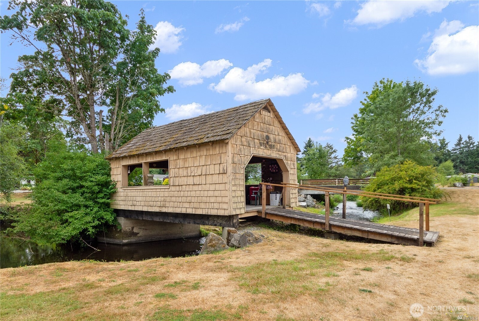18425 Northeast 95th Street, Unit 110 Redmond, WA 98052 - Photo 19 of 25 a view of house with backyard and sitting area