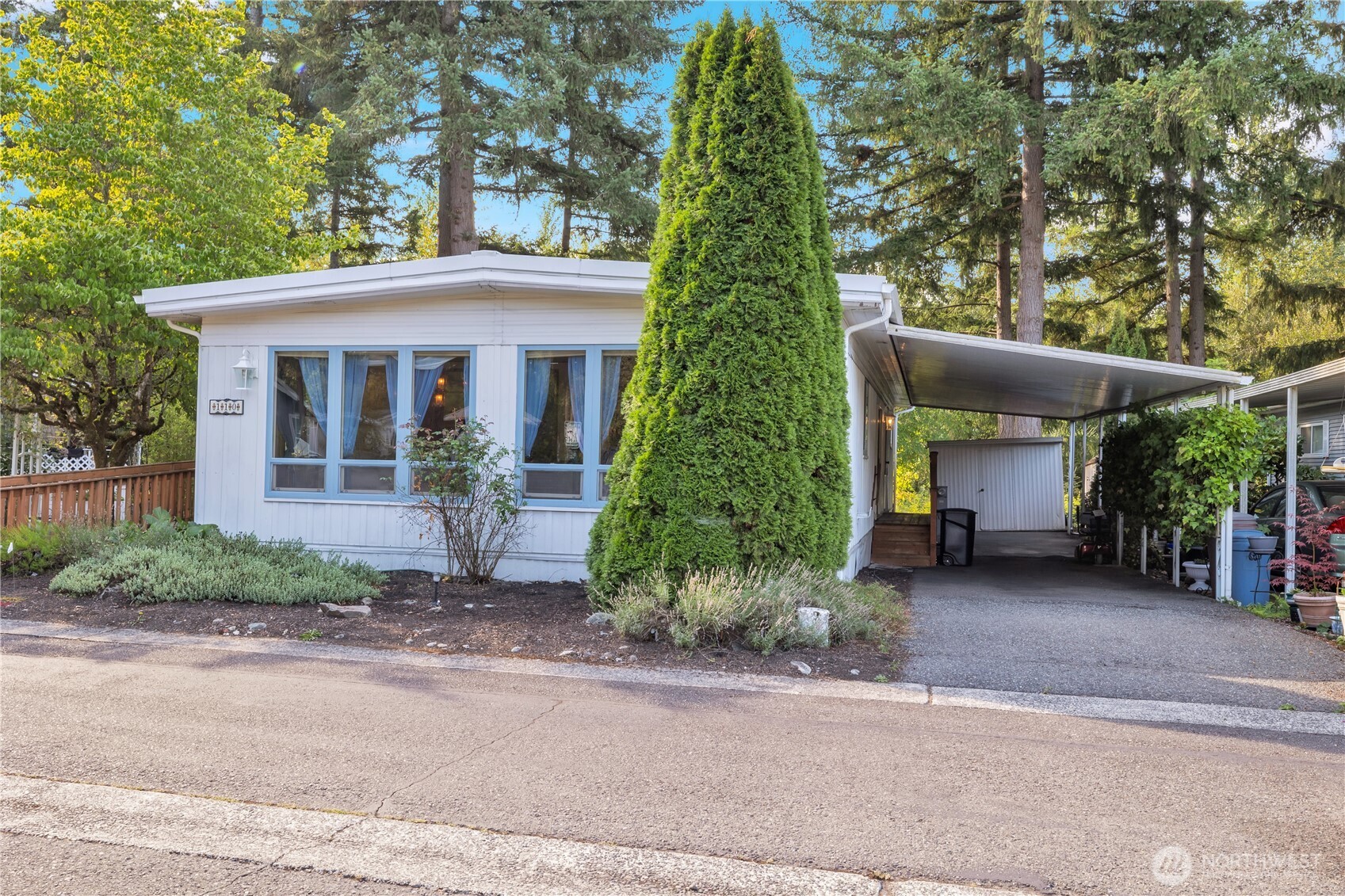 18425 Northeast 95th Street, Unit 110 Redmond, WA 98052 - Photo 2 of 25 a view of a house with a garden and plants