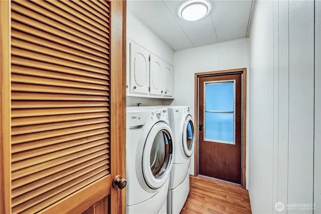 a view of a kitchen with washer and dryer