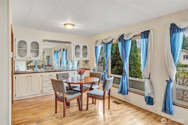 a view of a dining room with furniture and window