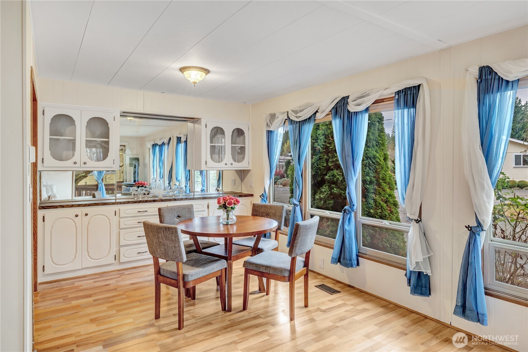 18425 Northeast 95th Street, Unit 110 Redmond, WA 98052 - Photo 5 of 25 a view of a dining room with furniture and window