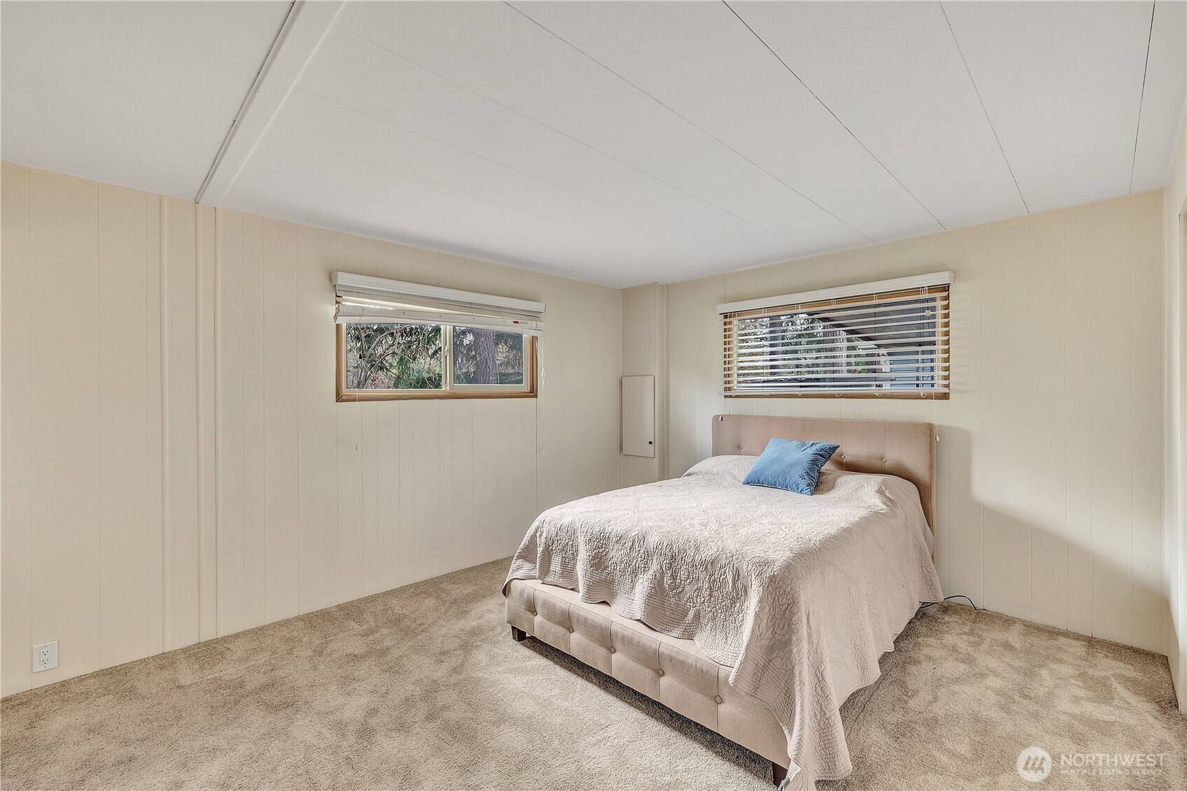 18425 Northeast 95th Street, Unit 110 Redmond, WA 98052 - Photo 10 of 25 a bedroom with a bed lamp and a window