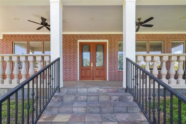 a view of balcony with wooden floor and windows