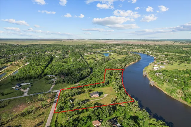 a view of a lake with a yard