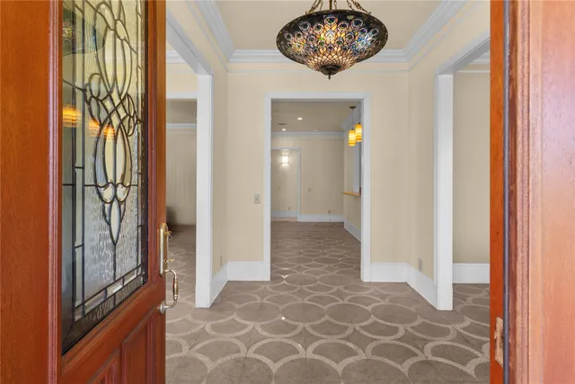 a view of an entryway with a chandelier