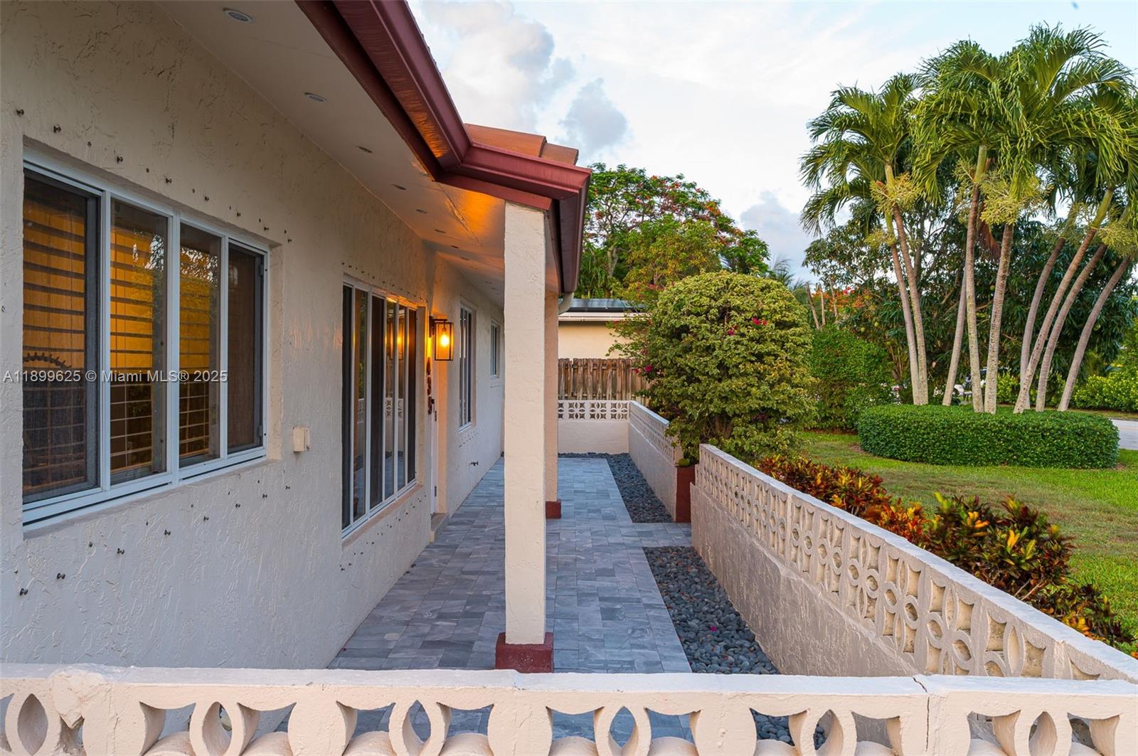 435 Northeast 36th Street Boca Raton, FL 33431 - Photo 3 of 25 a view of a house with backyard and sitting area
