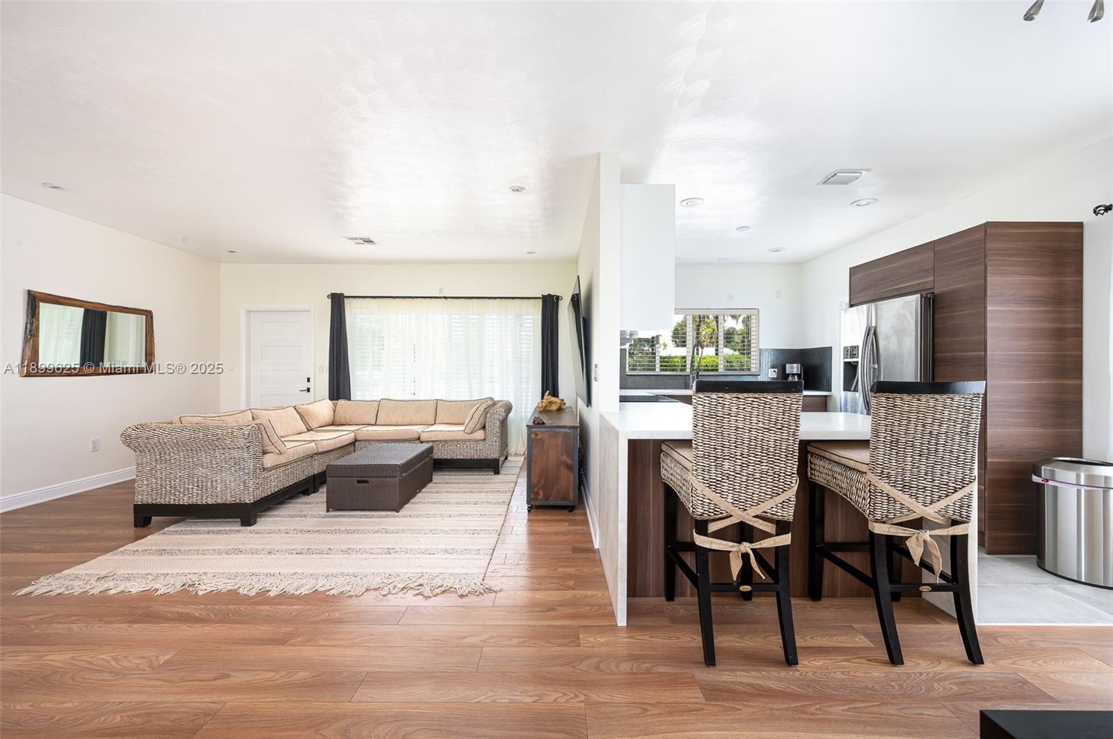 435 Northeast 36th Street Boca Raton, FL 33431 - Photo 10 of 25 a living room with furniture and a table