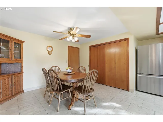 a view of a dining room with furniture and a chandelier