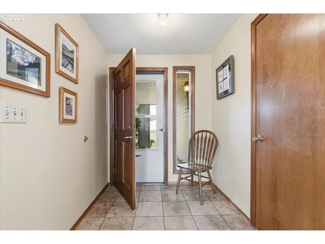 a view of living room with furniture and a painting