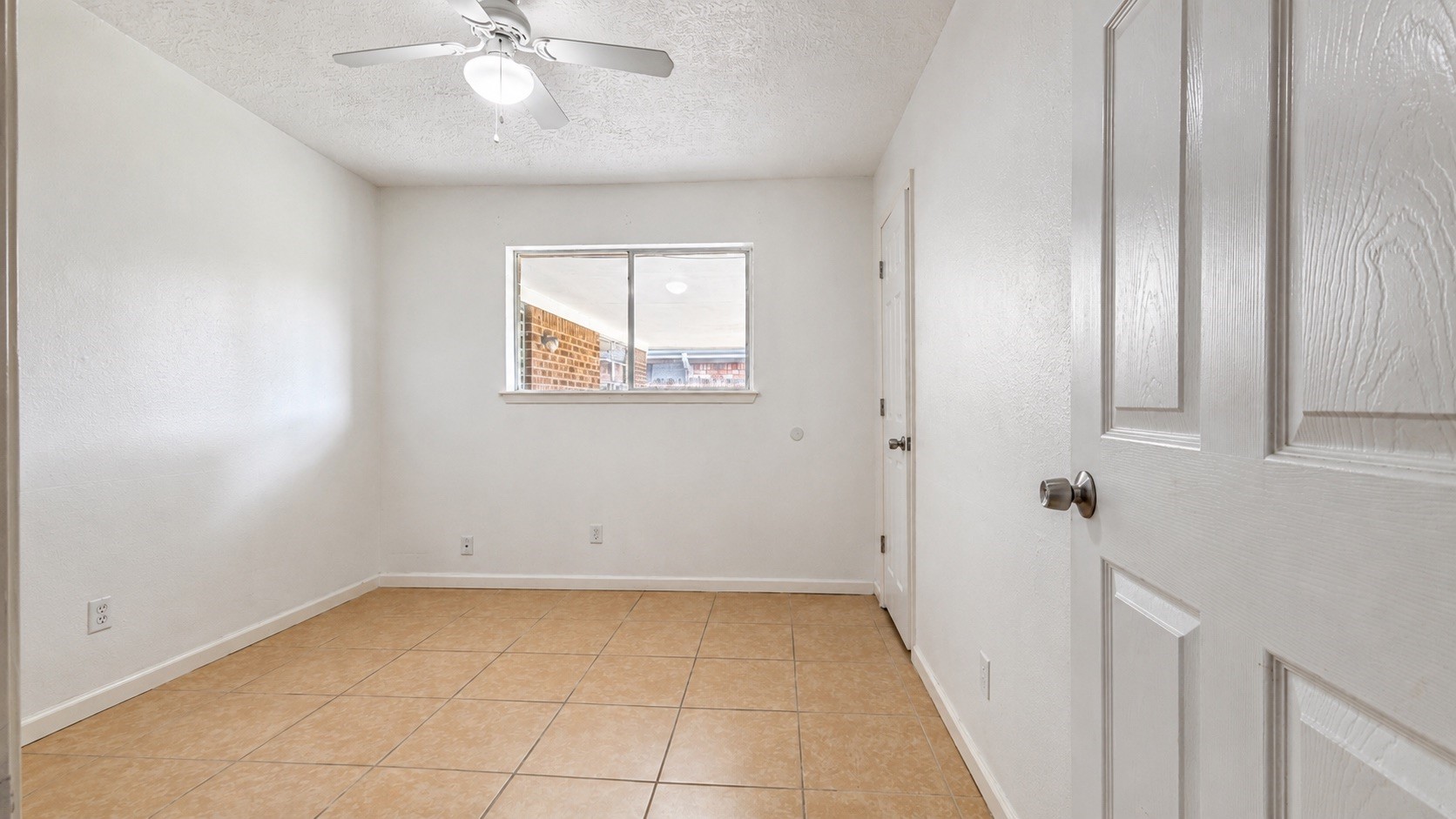 4418 Ponca Street Pasadena, TX 77504 - Photo 14 of 23 Another bedroom option ready for guests, work, or everyday living. (image has been enhance for marketing purposes)