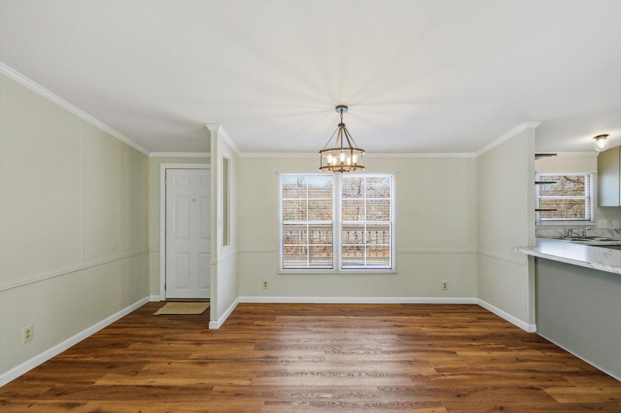 64 County Road 100 Decatur, TN 37322 - Photo 5 of 43 a view of an empty room with wooden floor and a window