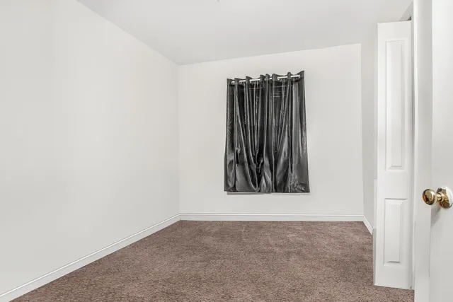a bathroom with a sink and mirror with toilet