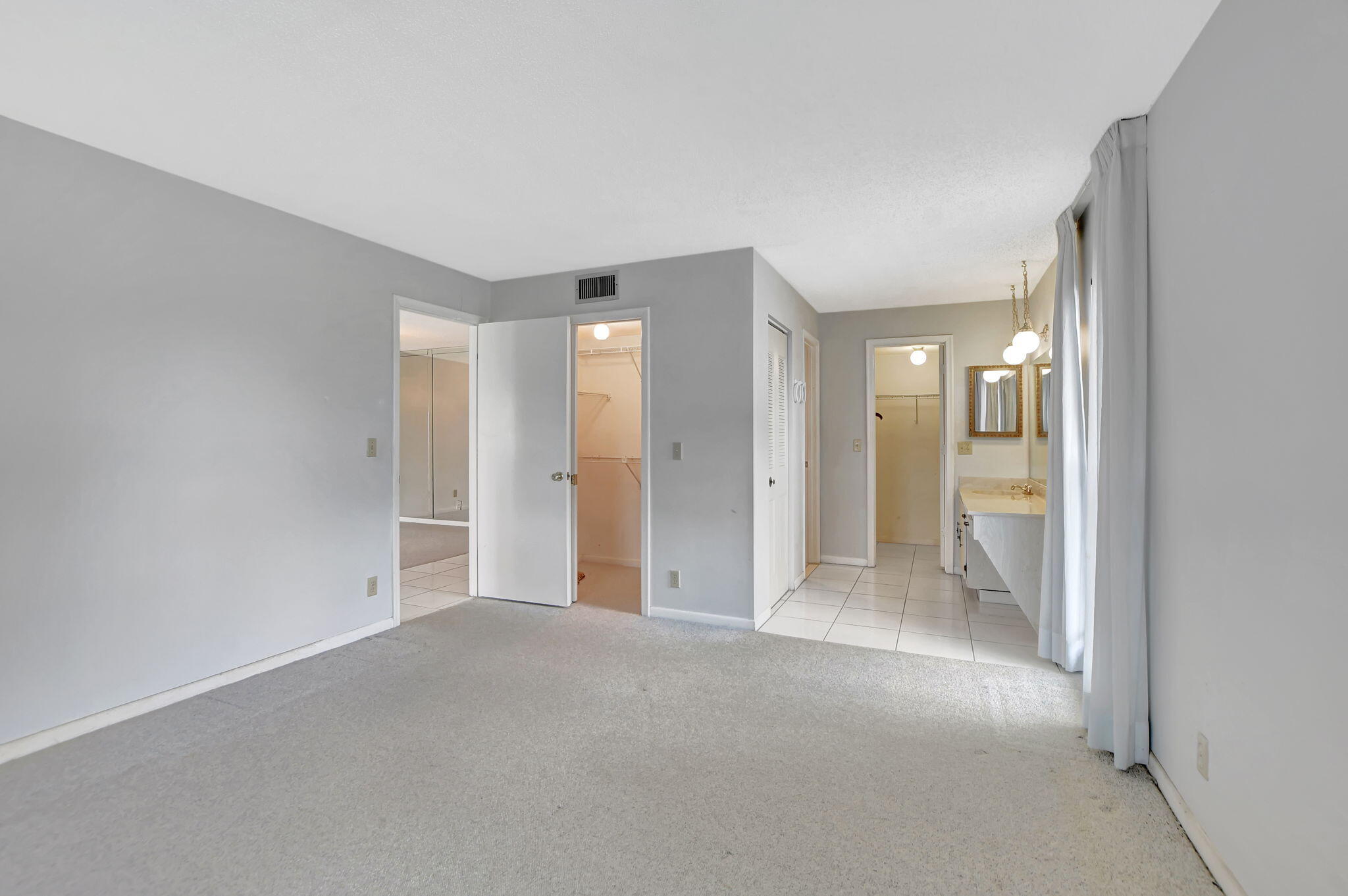 2830 Southwest 13th Street, Unit 101 Delray Beach, FL 33445 - Photo 20 of 56 Primary Bedroom