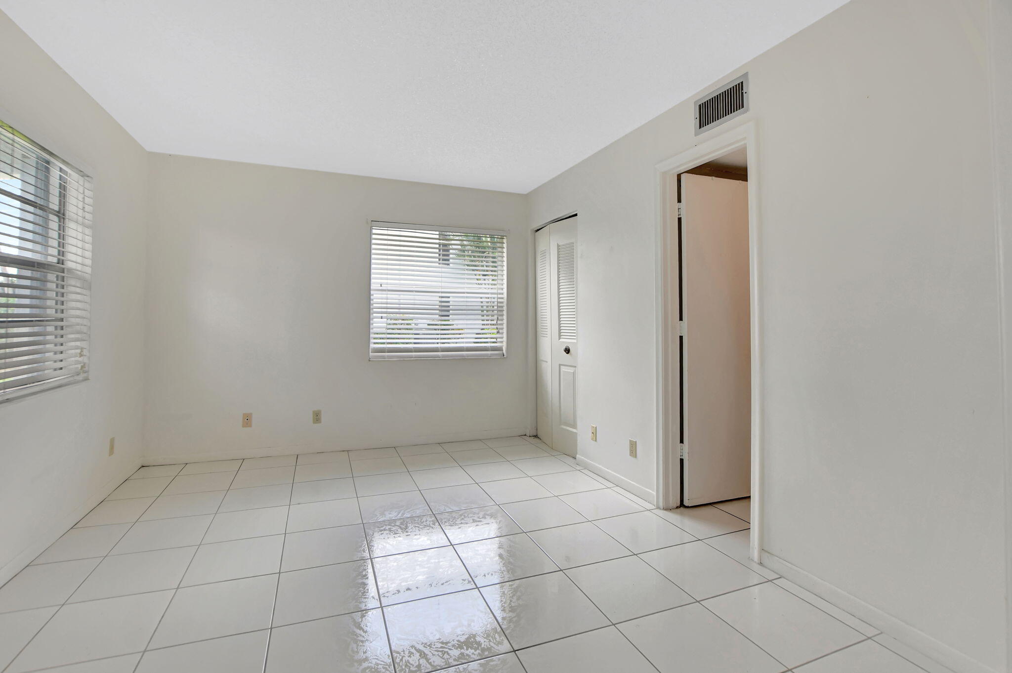 2830 Southwest 13th Street, Unit 101 Delray Beach, FL 33445 - Photo 23 of 56 Second Bedroom