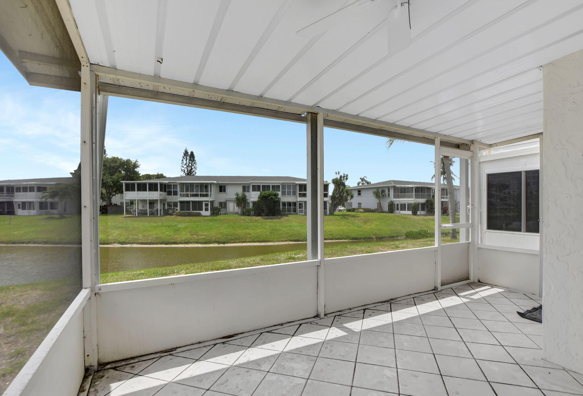 2830 Southwest 13th Street, Unit 101 Delray Beach, FL 33445 - Photo 27 of 56 Screened Patio