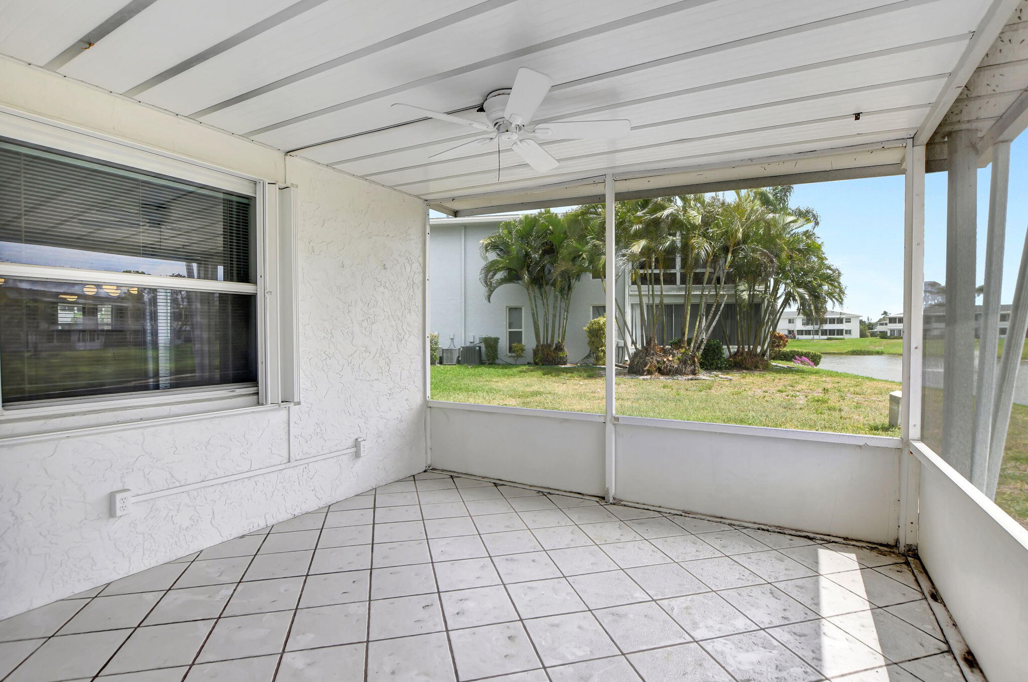 2830 Southwest 13th Street, Unit 101 Delray Beach, FL 33445 - Photo 28 of 56 Screened Patio