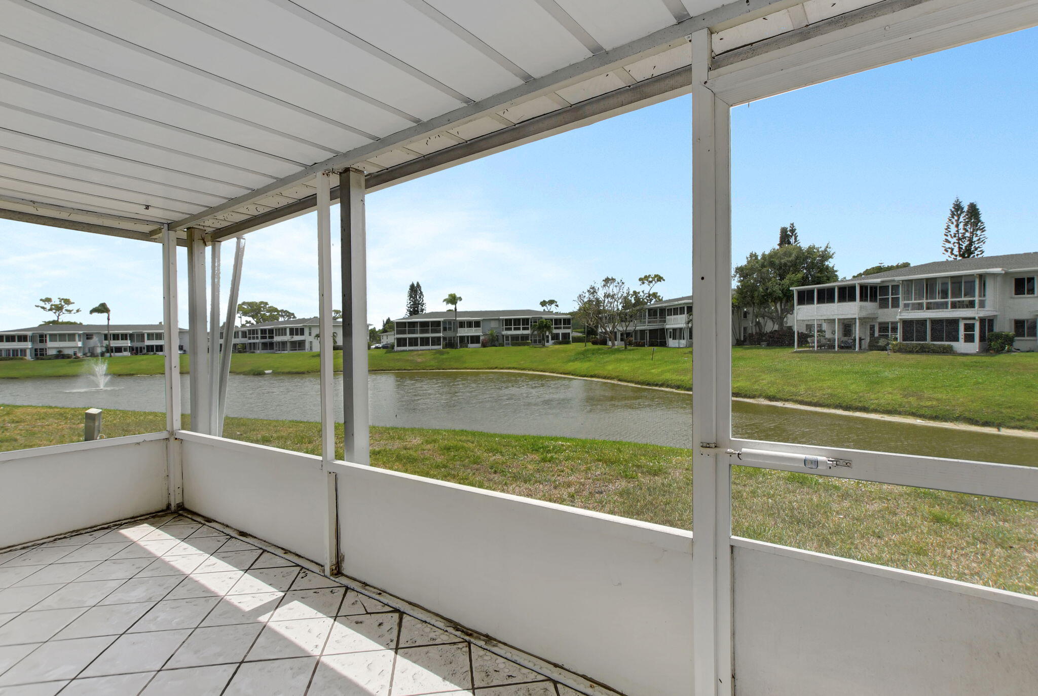 2830 Southwest 13th Street, Unit 101 Delray Beach, FL 33445 - Photo 29 of 56 Screened Patio