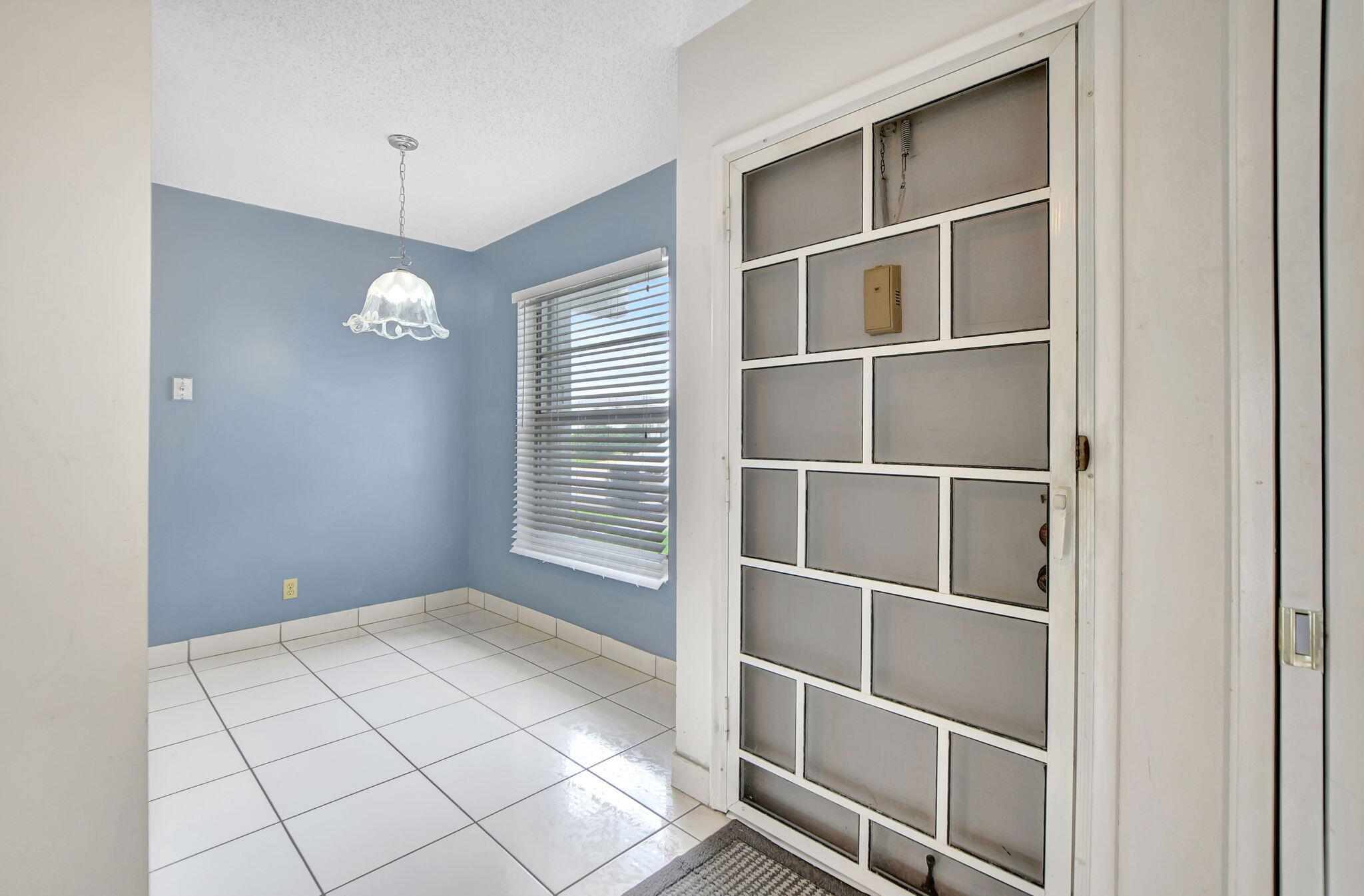 2830 Southwest 13th Street, Unit 101 Delray Beach, FL 33445 - Photo 8 of 56 Front Door & Eat-in Kitchen