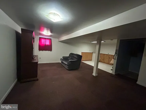 a room with furniture and a flat screen tv