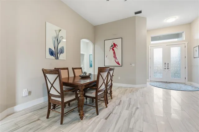 a view of a dining room with furniture window and outside view