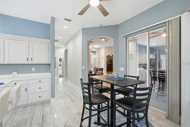 a kitchen with cabinets stainless steel appliances and a counter space