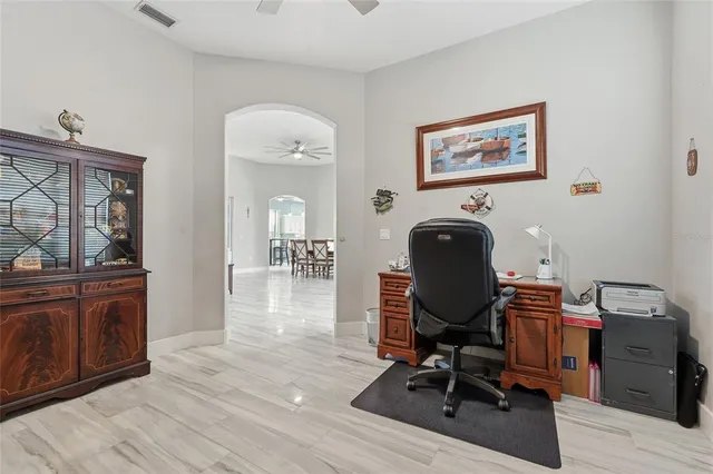 a bedroom with a bed and a potted plant