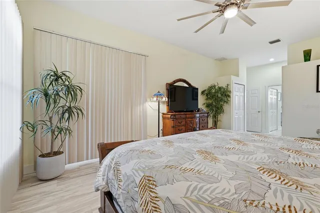 a bathroom with a sink mirror and tub