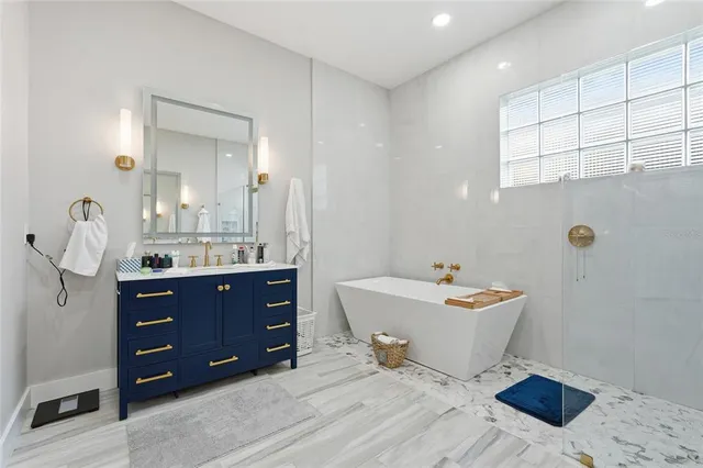 a bedroom with a bed and a dresser in it