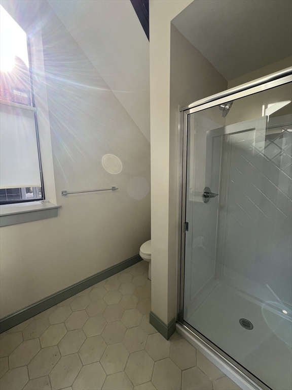 160 Seabury Street, Unit 16 Fall River, MA 02720 - Photo 8 of 11 a bathroom with a glass shower door