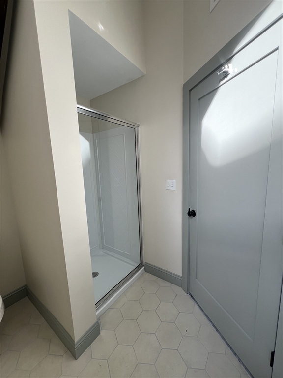 160 Seabury Street, Unit 16 Fall River, MA 02720 - Photo 9 of 11 an empty room with mirror