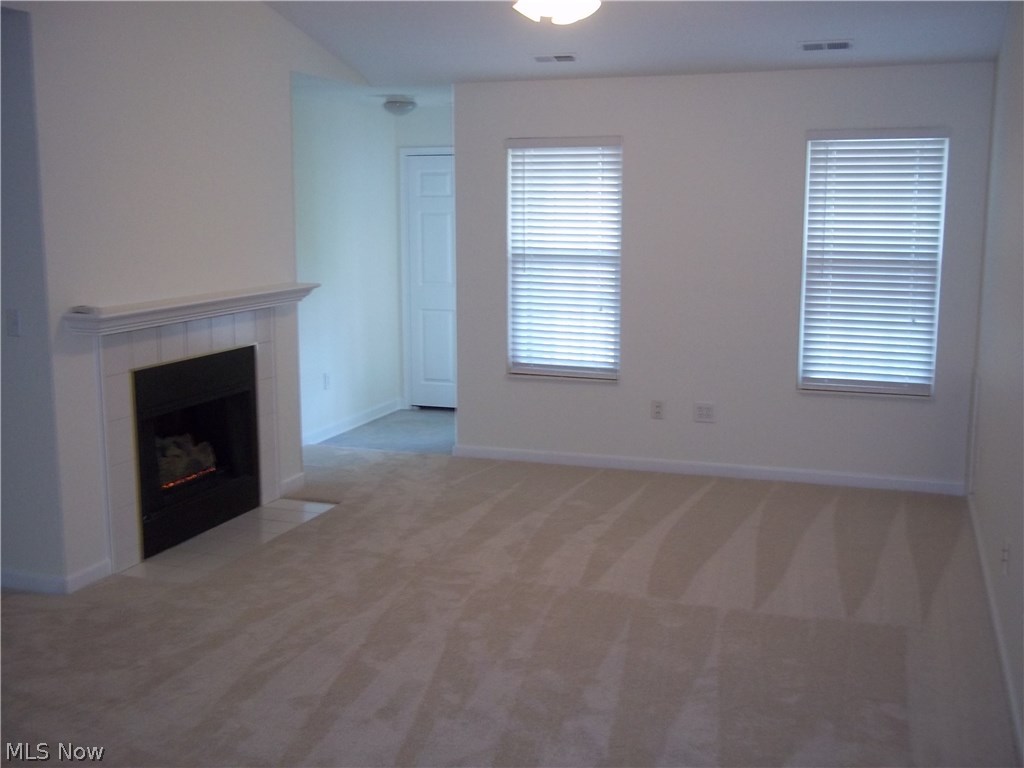 28340 Center Ridge Road, Unit 126 Westlake, OH 44145 - Photo 11 of 13 Gas fireplace in Great Room. Door leads to private balcony