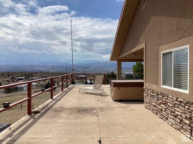 3 Red Circle, Unit 19 Manila, UT 84046 - Photo 23 of 29 View of patio featuring a mountain view and a hot tub