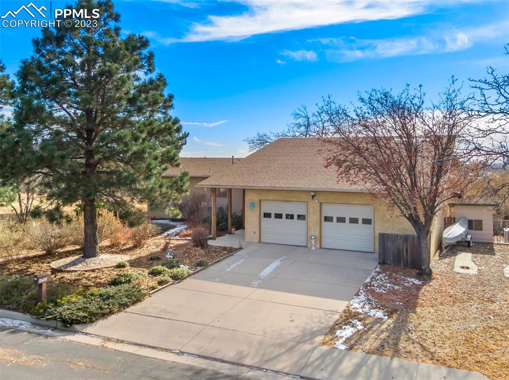 1711 Columbine Road Colorado Springs, CO 80907 - Photo 1 of 50 a view of a house with a yard