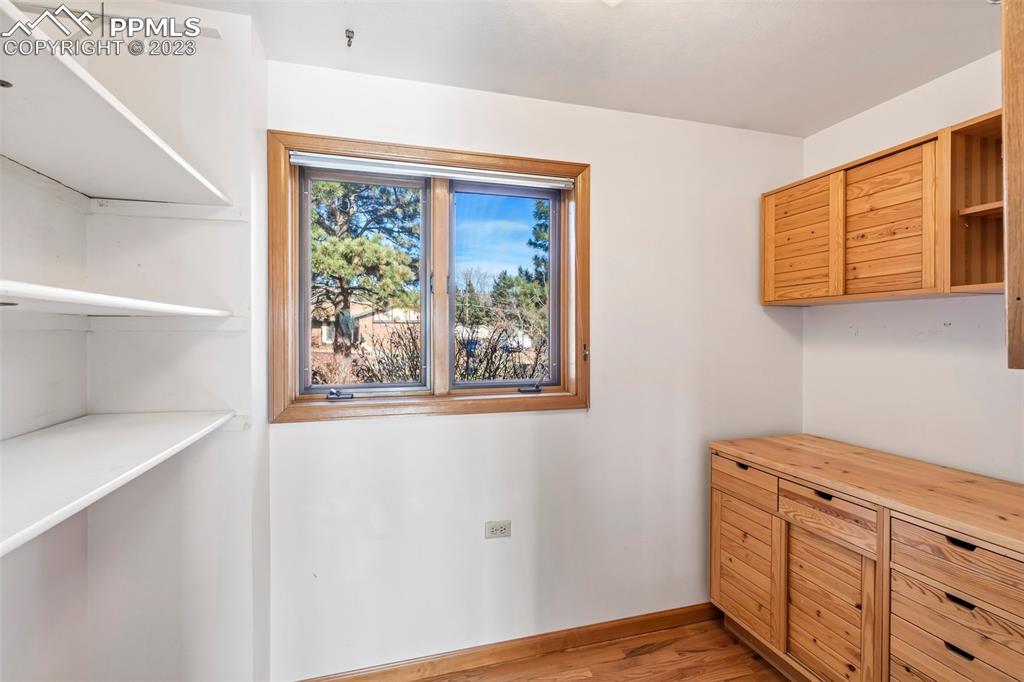 1711 Columbine Road Colorado Springs, CO 80907 - Photo 15 of 50 a view of a kitchen with wooden floor and cabinet